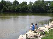 Kids fishing at Bay Beach Wildlife Santuary's newly restored wetland. 
- FWS photo by Gary Van Vreede 