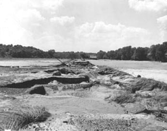 County road washed out 
             near Beaty Collins farm, (Lakeview Road, east-west), 100 yards south of the 
             Kansas River, Douglas County, Kansas.  On both sides of the road valuable 
             cropland was lost from the overflow of the Kansas River (photo courtesy of U.S. 
           Department of Agriculture, Natural Resources Conservation Service, Lawrence)