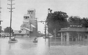 Locust Street was limited to 
             boat traffic for several days (photo courtesy Lawrence Journal World).