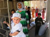 Women and children affected by landslide receive lentils and vegetable seeds