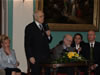 USAID/Russia Mission Director Terry Myers (right) looks on as Maestro Rostropovich speaks at the close-out celebration