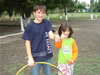 Young Uchgun residents Idris Zeynalov, 14, and Leyla Ibrahimova, 7, enjoy learning new games with their neighbors