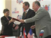 Acting USAID Director Janina Jaruzelski exchanges signed originals of MOC with St. Petersburg officials