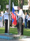 A camper raises the Russian flag during opening ceremony of the CIVITAS-sponsored civic youth competition