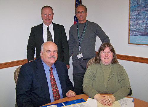 (Seated L to R) Dave Loughlin, New Jersey Department of Health and Senior Services;  Lisa Levy, Area Director, Region II, Hasbrouck Heights, New Jersey Area Office, USDOL-OSHA (Standing L to R) Mark Wadiak, Chief of Health, New Jersey Department of Labor and Workforce Development; David Volpe, Director, Bergenfield New Jersey Health Department.