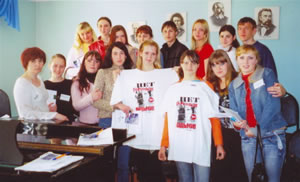 Participants pose for the camera at an anti-trafficking forum in Nakhodka