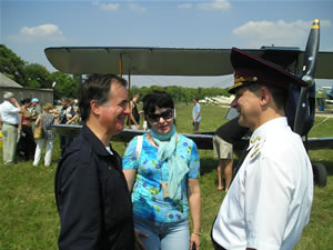 Larissa Kazachenko, with her husband (right) and Mr. Maxi Gainza, a member of the elite British Air Squadron Club, during the Crimea vintage planes exhibition, as a part of 150th anniversary of the Crimean War commemoration (2005)