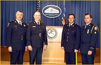 Representatives of Canadian Law Enforcement at the Press Conference Inspector Douglas Handy, Detective Chief Superintendant Dave Crane, Superintendant Mike Gaudreau, and Inspector Jeff McGuire