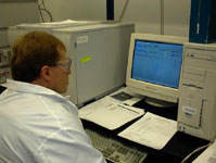 U.S. Geological Survey scientist examining results of chromatographic analysis.