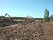 Oneida Nation Suamico wetland restoration project ditch plug and berm construction.