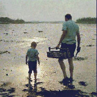Photo of father and son clamming on mudflates