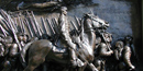 A detail from sculpted Shaw Memorial, showing a man on horseback and soldiers marching alongside. NPS Photo.