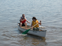 Couple canoeing on the bay.