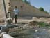 A potable water main, crudely repaired with plastic bags, runs through a raw sewage canal near a residential area of Nasiryah, southern, Iraq. Distribution of potable water remains a big problem for the citizens. USAID partner, RTI is working on solutions for aging and poorly maintianed water and wastewater infastructure. 