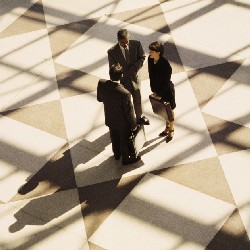 Three business professionals standing together