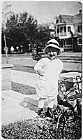 H0029-4. Gerald R. Ford, Jr. standing on front walk of a house. 1916. 