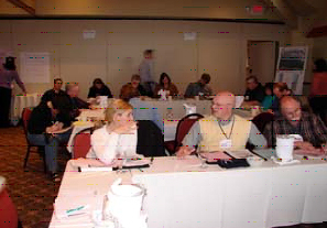 USGS researcher Rachel Sleeter talking with U.S. Postal Service and Oregon Department of Transportation representatives at the Post-Disaster Tsunami Recovery Forum, 2006