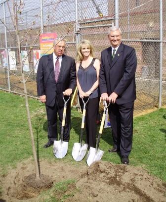 Boston Mayor Thomas Menino, Shonda Schilling and EPA Administrator Stephen Johnson stop to pose for a photograph while planting one of the 100 trees the SHADE Foundation donated to the City of Boston.