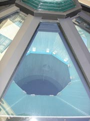 Close up photo of cistern beneath glass.