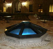 Photo of completed cistern at night.