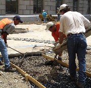 Photo of construction crew pouring permeable concrete.