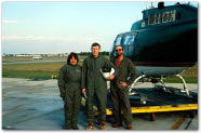 Maggie, Chip and Tom standing by the helicopter
