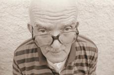 Photograph of a senior man with glasses