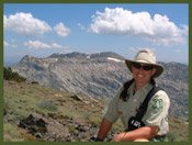 [Photo]:  Mokelumne Wilderness stretches out behind Eldorado National Forest Wilderness Ranger Amy Reid.  2002 Marilyn Muse-Meyer, USFS.