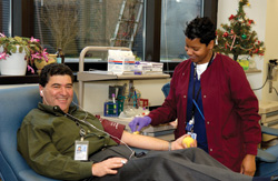 NIH Director Dr. Eliad Zerhouni donating blood.
