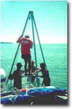 photo of USGS researcher collecting a core sample