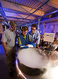 Plant physiologists visiting Brazilian geneticist remove pepper seeds from long-term storage in liquid nitrogen: Click here for full photo caption.