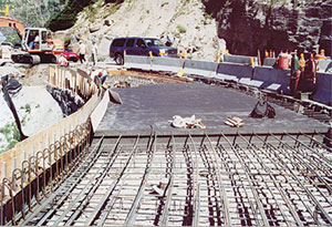 As shown in this photo, more durable and longer-lasting reinforced concrete pavement is being installed in rockslide and avalanche-prone areas such as this site just east of Triple Arches.