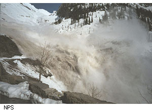 Over the years, avalanches, such as this one that took place on May 22, 2003, at Haystack Creek, have ripped up pavement, sheared off guard walls, and caused other road damage at 70 known avalanche chutes along the Sun Road.