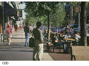 Where possible, removing vehicle lanes in favor of expanded sidewalks-and here in Cambridge's Central Square, providing space for outdoor seating for restaurants and trees for shade-helps create what some call more livable, sustainable cities.