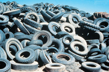 Scrap tires from piles such as this one can be shredded and used in highway applications as lightweight fill, retaining wall reinforcements, or insulation of the road base to resist frost heaves.