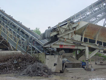 A magnetic belt removes the remaining metal from crushed concrete rubble.
