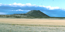 Color photograph showing Capulin Volcano in the distance