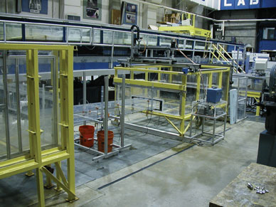 This photo shows the culvert setup in the FHWA Hydraulics Laboratory, with the model barrel between the head and tail boxes.