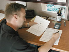 Photo of EPA employee reviewing document