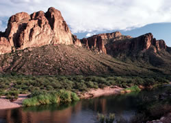 Photo of: Water flows through arid desert near Phoenix, AZ