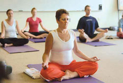 A group of people doing Yoga.