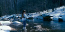 Young girl flyfishing on Big Hunting Creek in the winter.