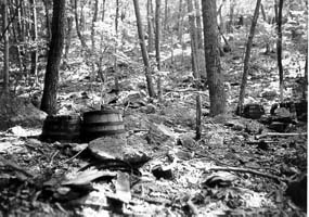 Old mash barrels are sometimes still discovered in the woods today.