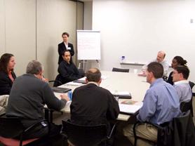 This photograph shows attendees participating in a breakout discussion group.