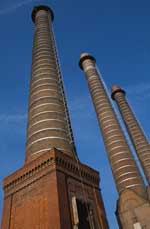 An image of a series of smoke stacks.