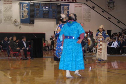 Attorney General Gonzales and Superintendent Dr. Mary Hall watch a cultural presentation by students at White Swan High School