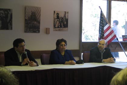 Attorney General Gonzales speaks to tribal justice officials about combating methamphetamine in Indian Country.  Also pictured are Yakama Chief Judge Elizabeth Nason (middle) and OTJ Director Tracy Toulou (right)