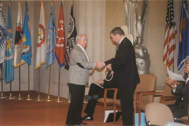 Philip Hogen, Associate 



                Solicitor for Indian Affairs, US Department of the Interior presenting 



                gift to the Attorney General