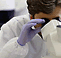 Scientist looking into a microscope