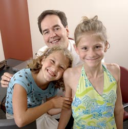 Mia, and Isabelle Jeppsen meet with Mia’s cochlear implant surgeon, John Niparko.